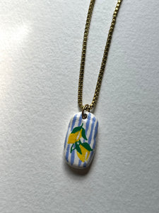 Lemon hand-painted Dolce Vita clay pendant necklace