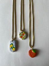 Load image into Gallery viewer, Oranges on blue gingham hand-painted clay pendant necklace