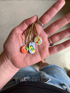 Oranges on blue gingham hand-painted clay pendant necklace